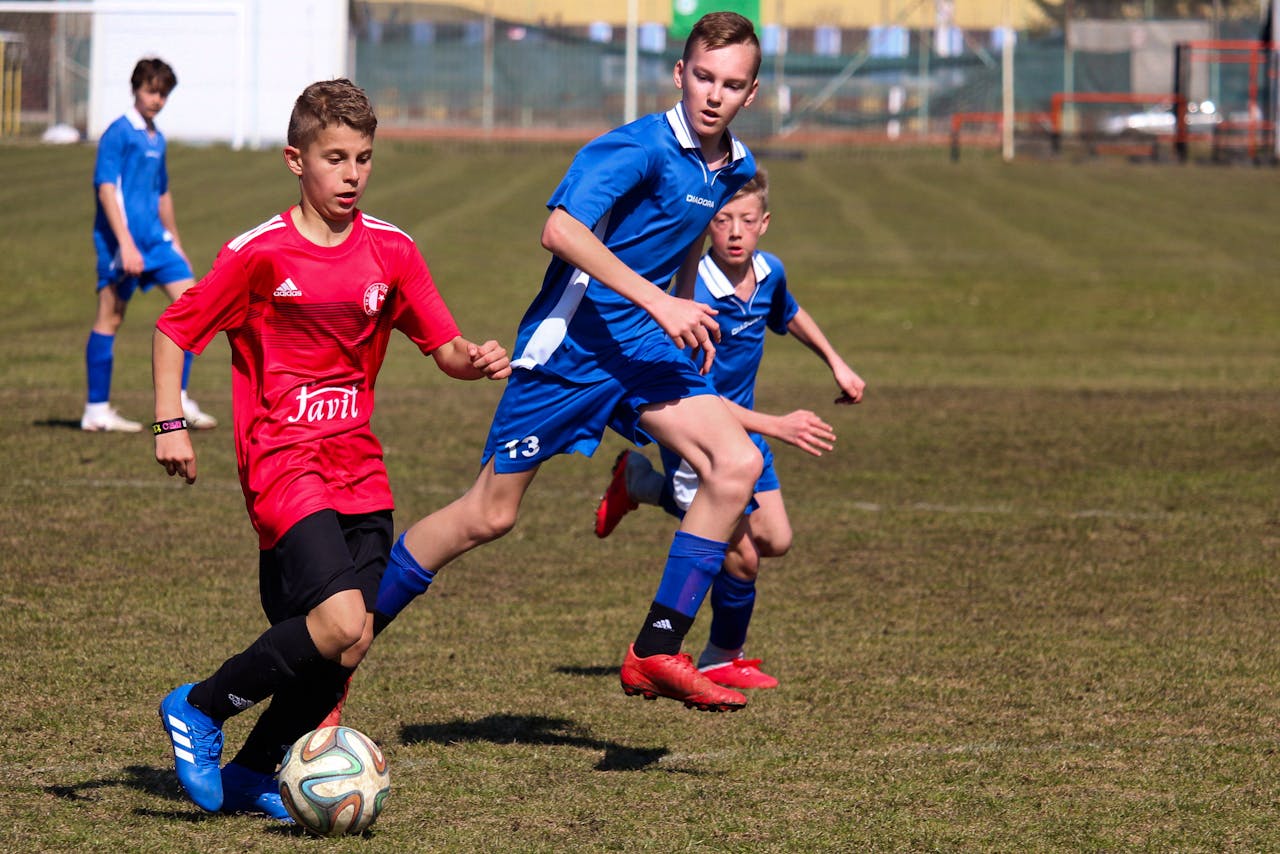 Boys Playing Soccer in the Field